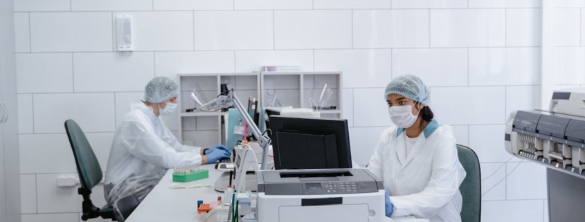 Lab technicians analyzing samples in a clean, modern laboratory.